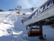 Hochmaisbahn - 6er Hochgeschwindigkeits-Sesselbahn (kuppelbar) mit Abdeckhauben und Sitzheizung